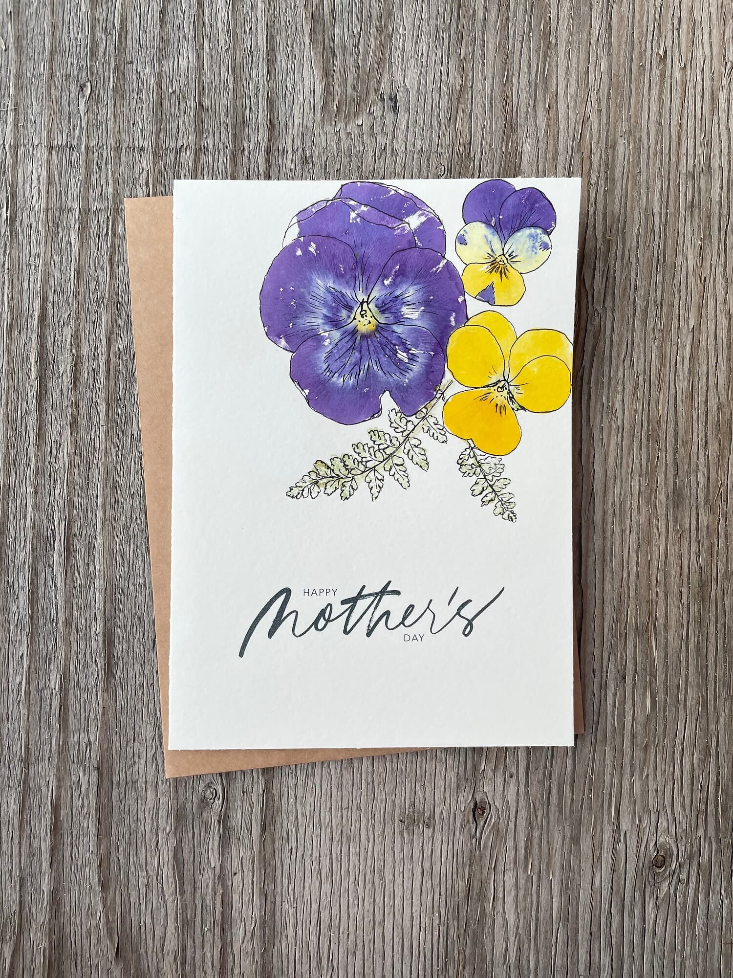 Various shapes and colors of pansies creating a rich small-scale design